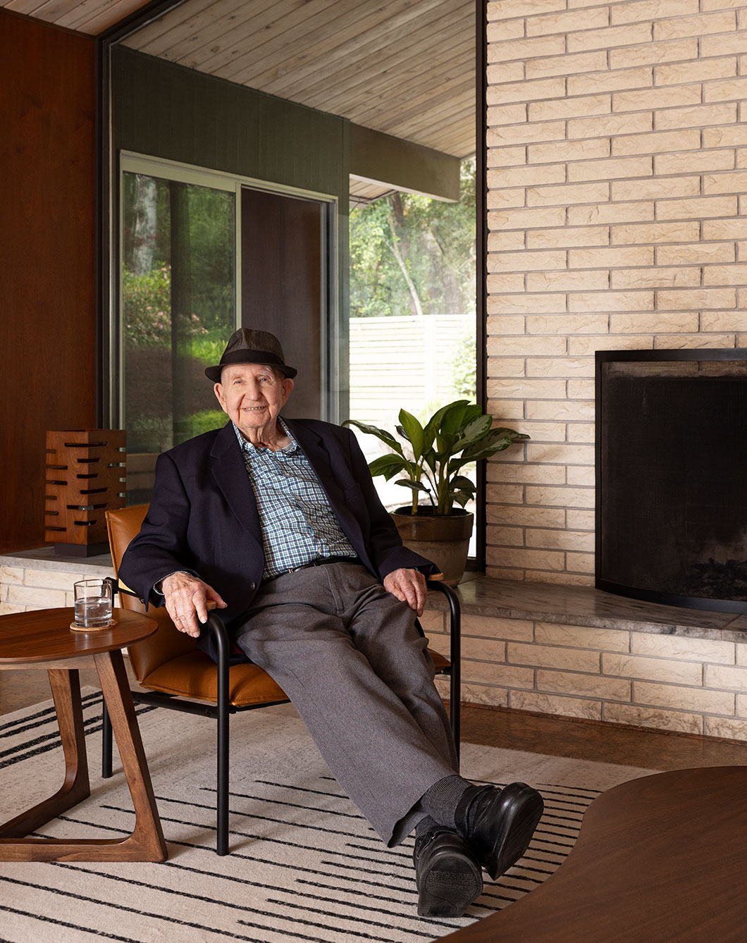 Robert Rummer seated in one of his Pacific Northwest mid-century modern homes